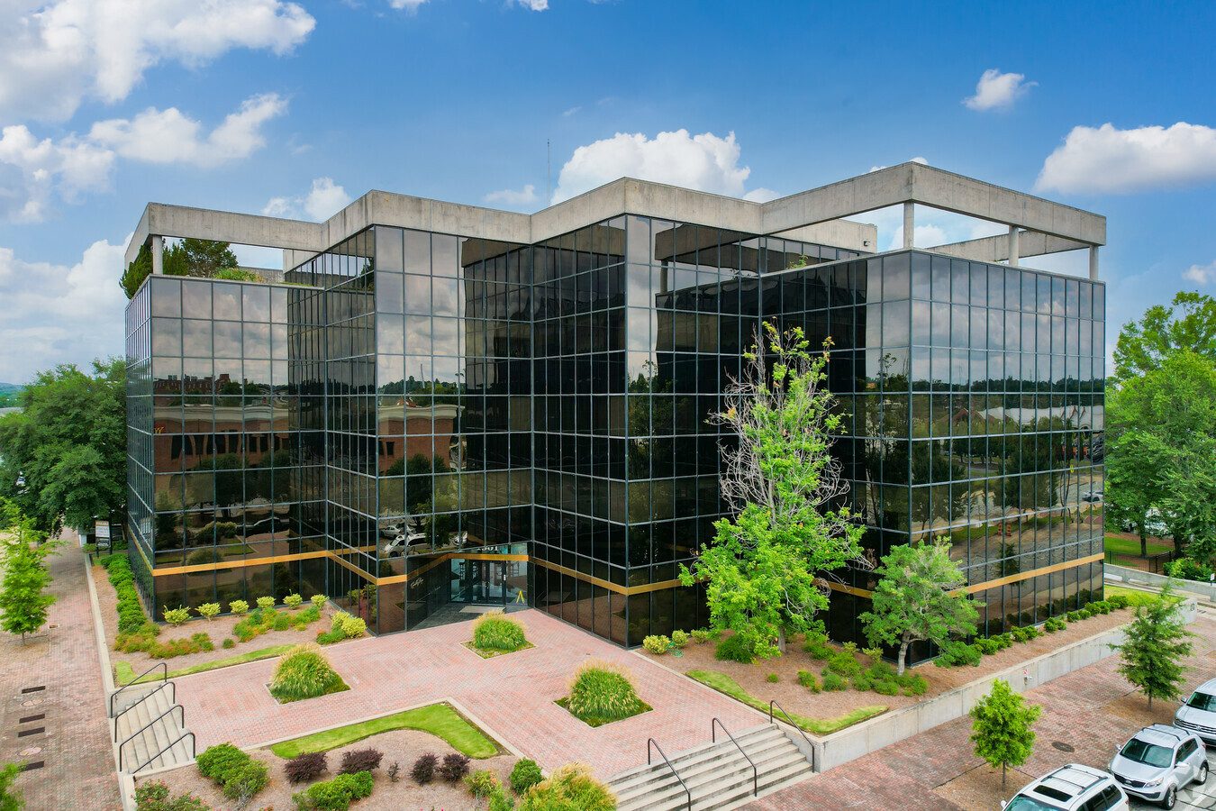 Modern glass office building, home base for the Olive Branch Capital team